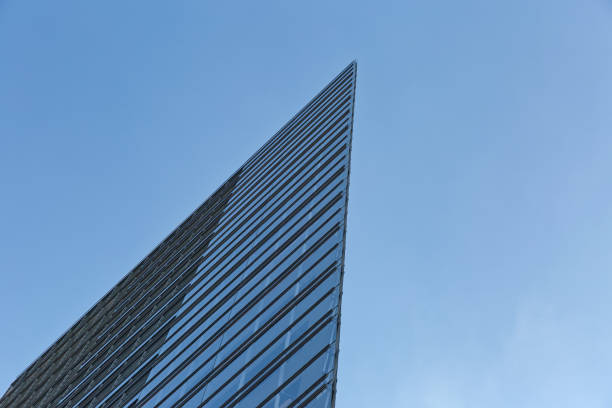 Architectural abstract of a curtain wall skyscraper, blue background
