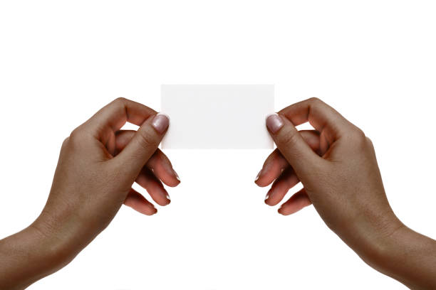 istock Isolated african female hands hold white card on a white background. 846888092