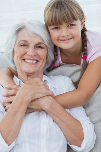 istock Young girl hugging her grandmother 846888550
