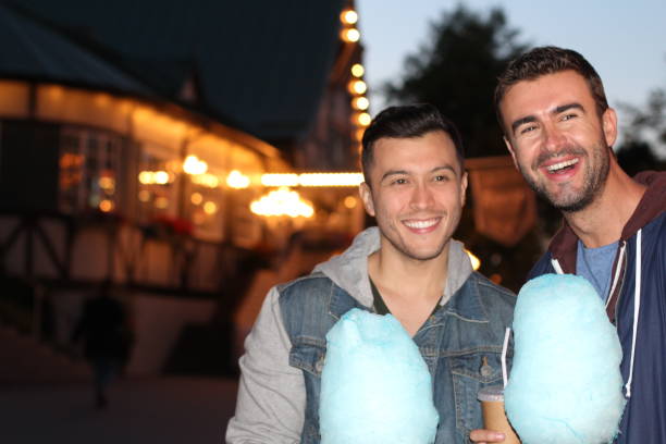 istock Happy couple smiling during date at theme park 846889286