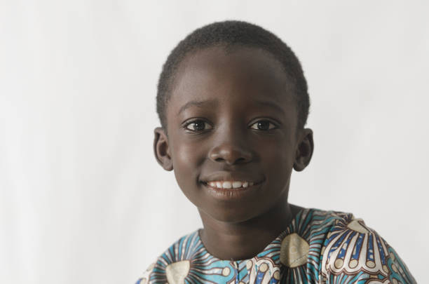 istock Young African boy smiles at the camera isolated on white 846891870