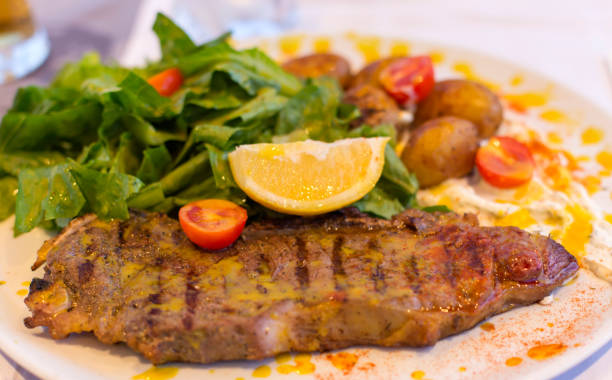 istock Steak meat grilled with lemon and lettuce 846893274
