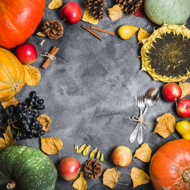 istock Autumn background from fallen leaves and fruits with vintage place setting on old table. Thanksgiving day concept, Flat lay, top view 846896602
