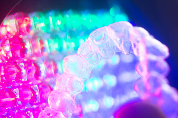 istock Invisible teeth retainers orthodontic brackets. Plastic modern straighterners to correct tooth alignment. 846897310