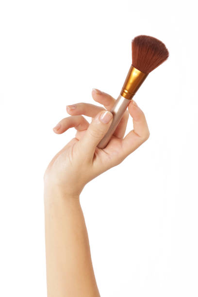 istock Hand with make up brush isolated on white 846907156