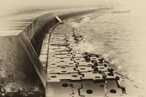Another example of a seawall only this one made with steel plates. I love the way this turned out. I used Nik Silver Effects Pro to convert to black and white. Then I used the tool antique plate II. I am kind of new to Nik software but can't believe I was't a fan before this.