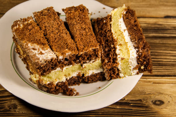 istock Sour cream cake on plate on wooden table 846917588