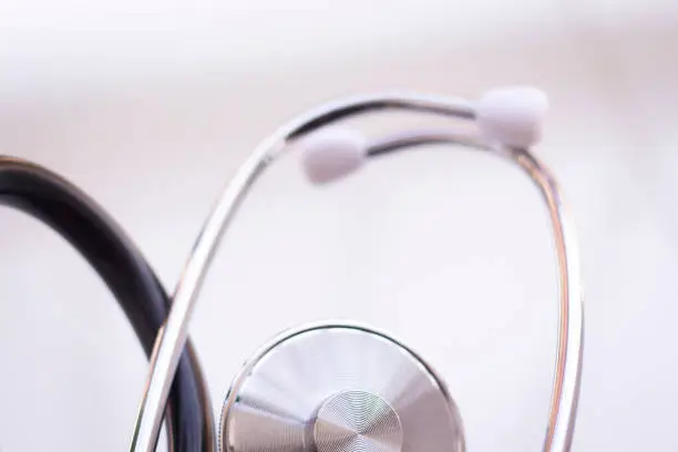 Medical doctor's stethoscope used to listen to patient heart rate, beats and monitor irregular heart beats