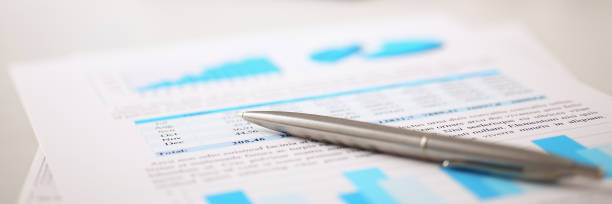 istock Financial statistics documents on clipboard pad at office table closeup 846928394