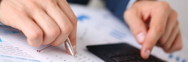 istock Black calculator and financial statistics on infographics 846928482