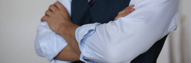 istock Male hands in suit crossed on chest closeup 846928574