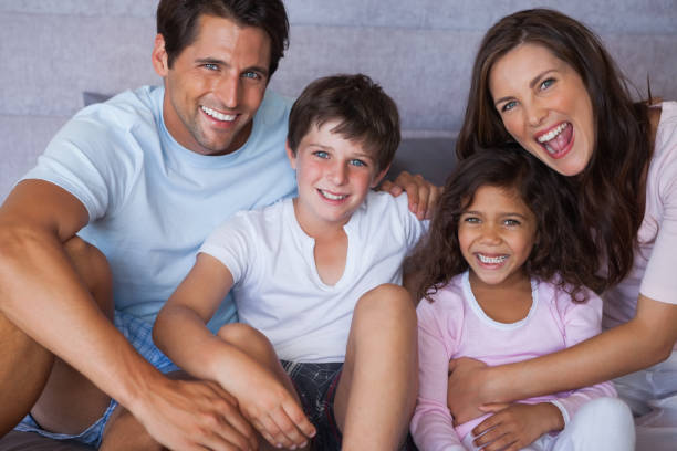 istock Parents and children smiling at camera 846931752