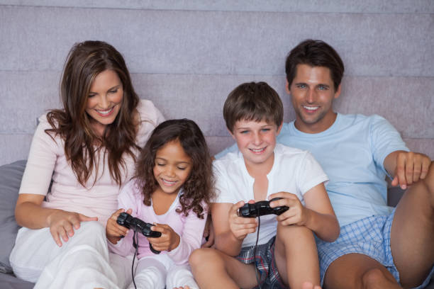 istock Smiling family playing video games 846931836