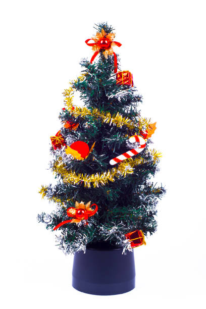 istock Decorated Christmas tree with patchwork ornament, artificial red star, hearts, hat and small presents for new year isolated on white background 846932214