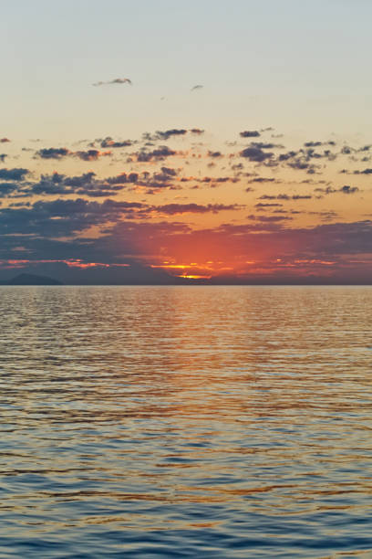 istock beautiful seascape with deep ocean waters and sunrise cloudscape 846932314