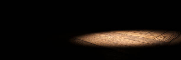 istock spotlight on wooden stage floor with black background 846936828