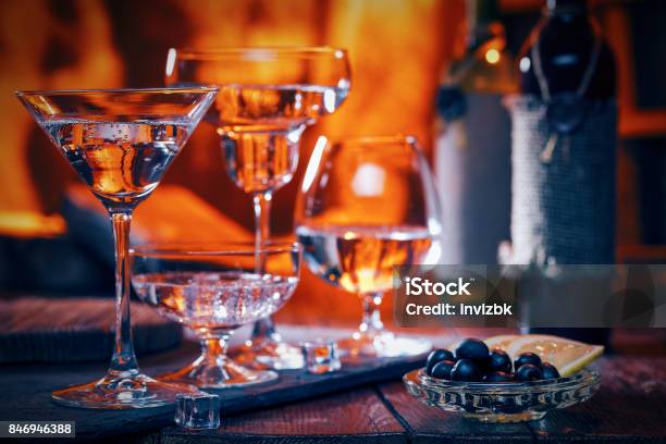 Cocktails Near Fireplace Stock Photo - Download Image Now - Cocktail, Fire - Natural Phenomenon, Winter