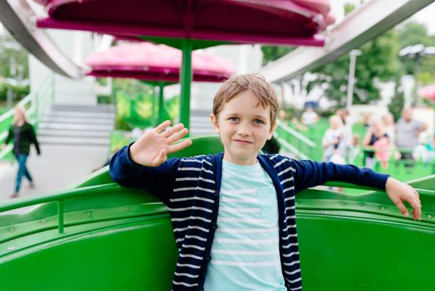 istock Happy child boy having fun in amusement park. 846956002
