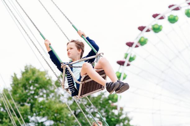 istock Happy child boy having fun in amusement park. 846956358