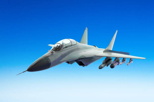 istock Military fighter fly above a blue sky 846956384
