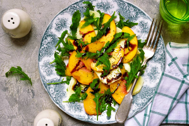 istock Peach salad with arugula and mozarella cheese 846975096
