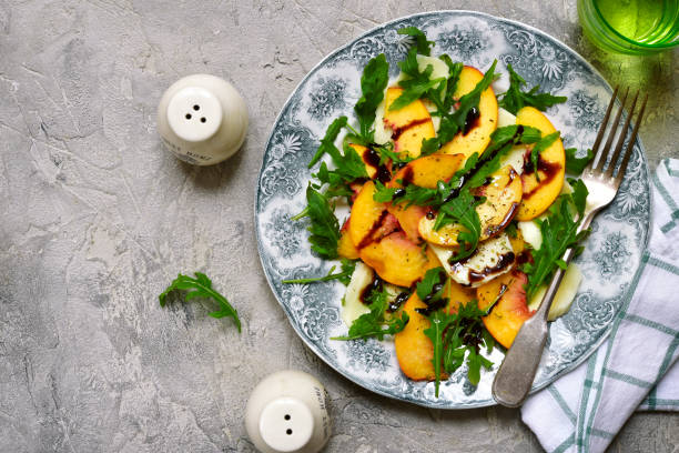 istock Peach salad with arugula and mozarella cheese 846975124