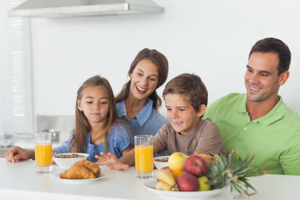 istock Parents having breakfast with children 846976146