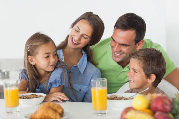 istock Parents having breakfast with their children 846976162