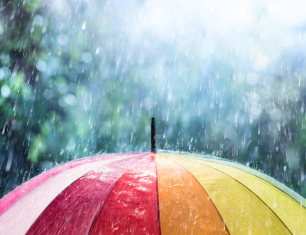 Rain On Rainbow Umbrella Multi Colored Umbrella With Raindrop Shower shower stock pictures, royalty-free photos & images