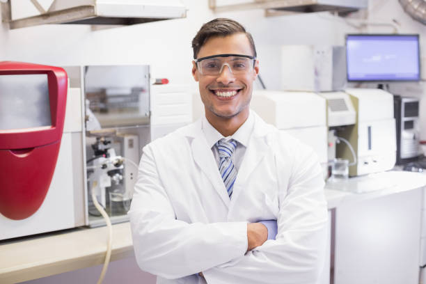 istock Smiling scientist looking at camera arms crossed 846993122