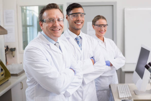 istock Smiling scientists looking at camera arms crossed 847008508