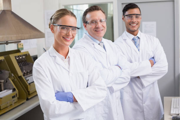 istock Smiling scientists looking at camera arms crossed 847008526