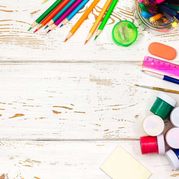 istock School supplies on a white wooden background with an empty space for inscriptions. 847008640
