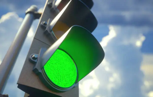 Traffic light with green light on, signal open to go ahead.