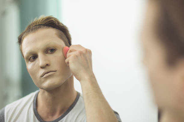 istock Man gets dressed in drag attire in bathroom 847012748