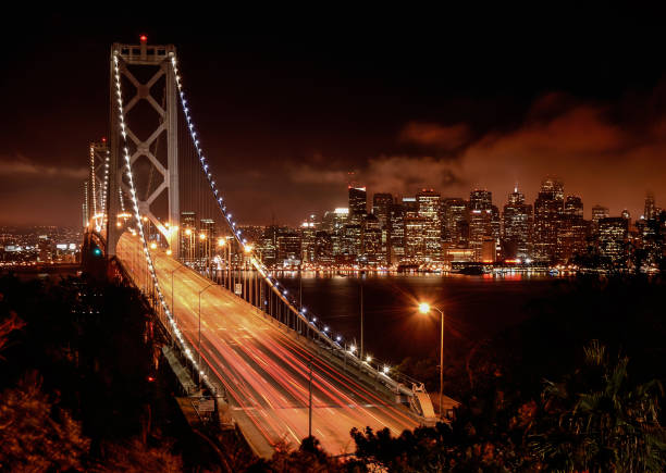 istock San Francisco Bay Bridge and skyline at night 847016014