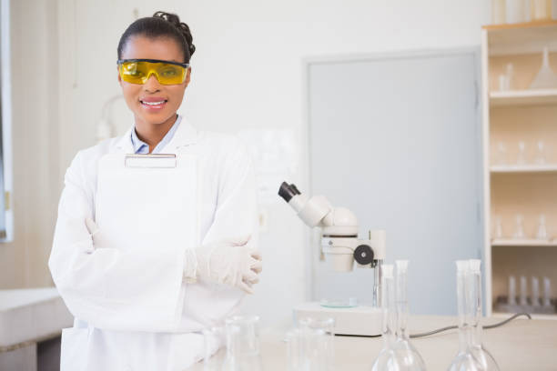istock Smiling scientist looking at camera and holding clipboard 847022650