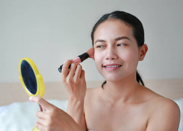 istock Beauty Girl with Makeup Brush. 847022812
