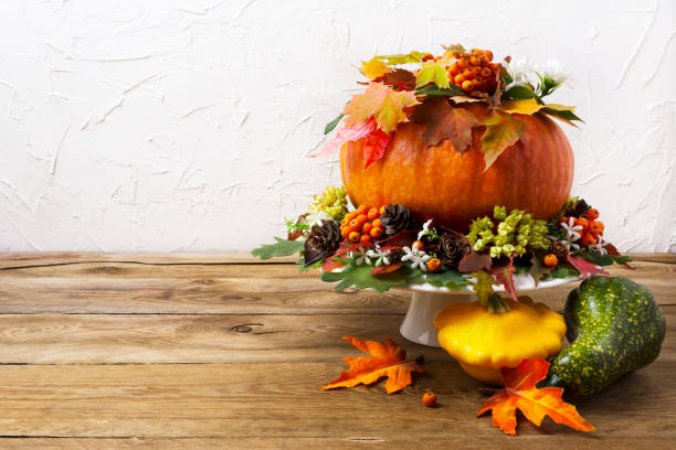 istock Thanksgiving table centerpiece with pumpkin and yellow squash, copy space. 847022934