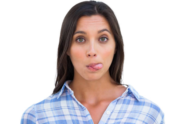 istock Silly woman with tongue out looking at camera 847023258