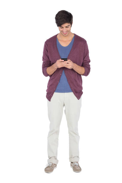 istock Smiling man looking at his mobile phone 847023510