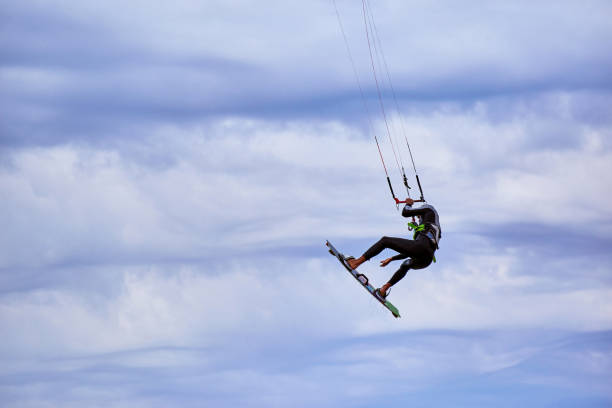 istock Kite Surfing on waves at sea in summer. 847025694