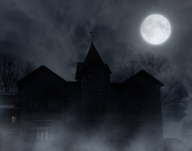 Abandoned wooden house in the moonlit night.Halloween background.