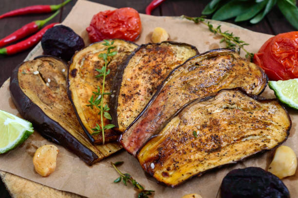 istock Baked eggplant with herbs and spices. Vegetarian cuisine. 847026624