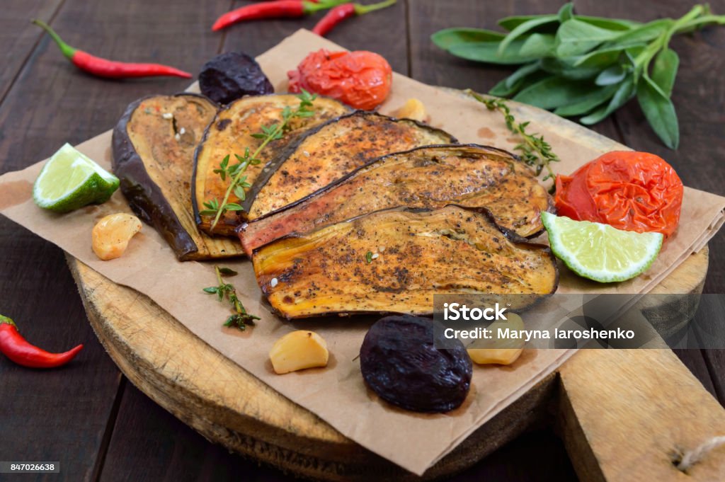 Baked eggplant with herbs and spices. Vegetarian cuisine. Eggplant Stock Photo