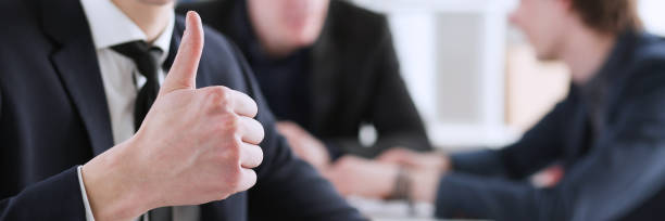 istock Male hand showing OK or approval sign with thumb up 847029798
