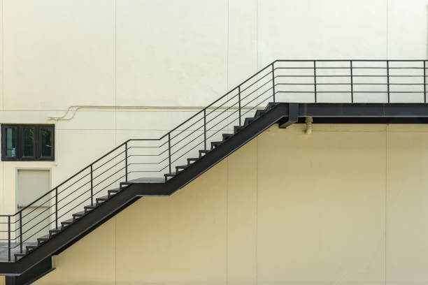 istock stair for fire escape with the steel railing and ladder 847034102