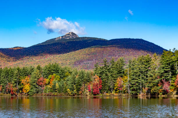 istock Fall foliage on the lake with mountain backdrop in New Hampshire 847036830