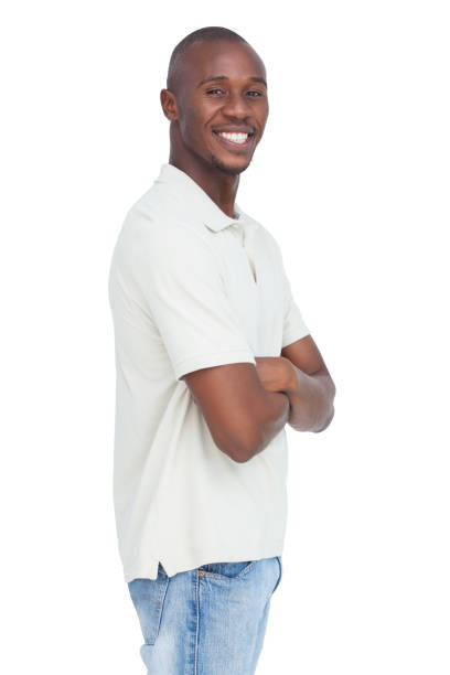istock Smiling young man standing with arms crossed 847039590