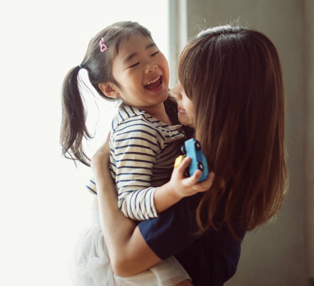 istock Mother and daughter playing together 847043290
